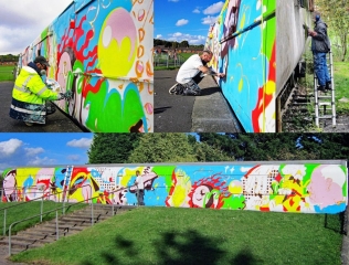 Artists painting the carriage at the Ironville YC